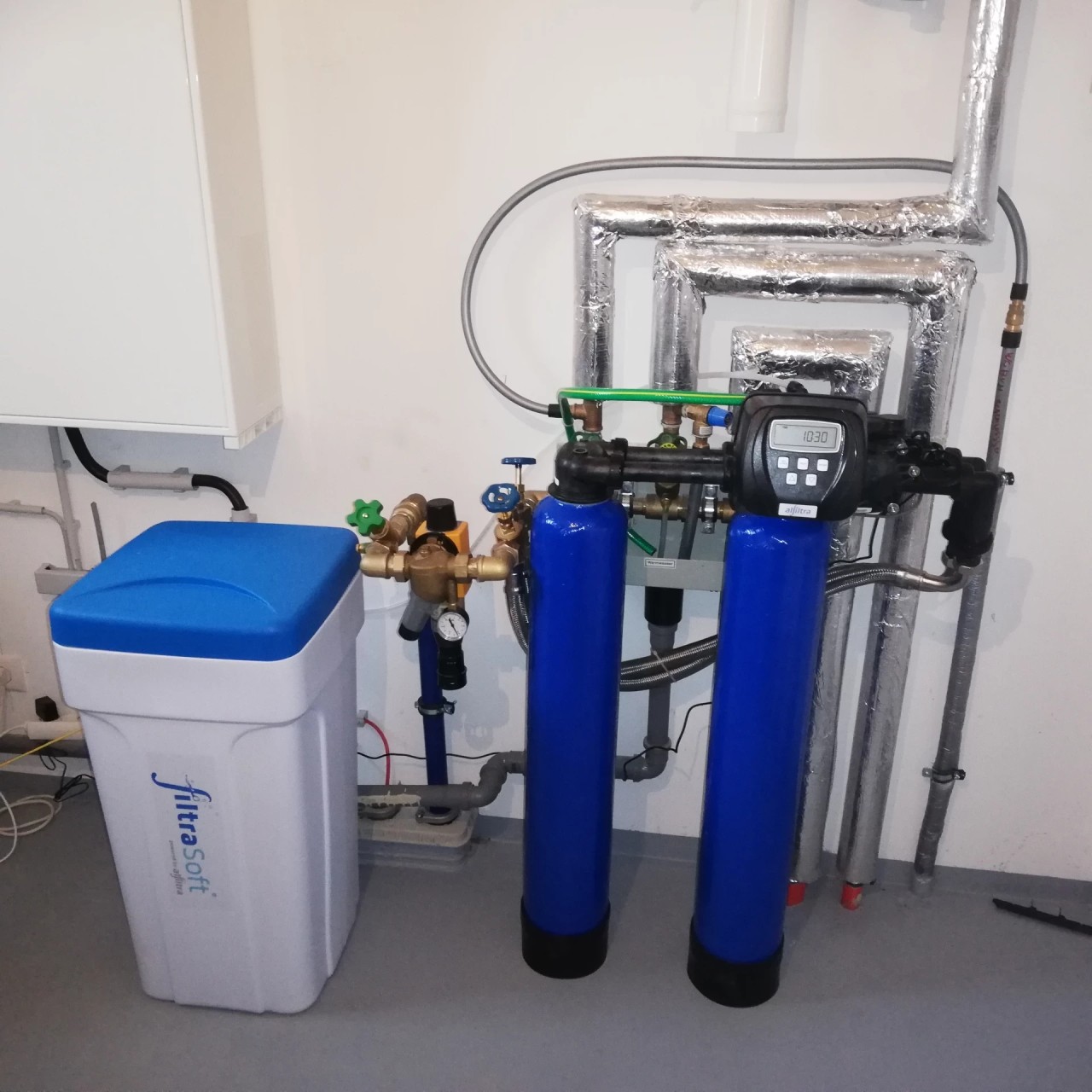 Duplex water softening system in a single-family house