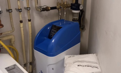 Water softening system and new backwash filter